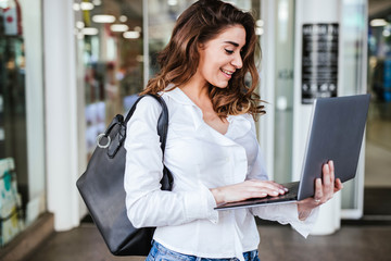 Business woman goes in a hurry to work