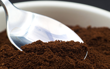 a spoon collects coffee in powder