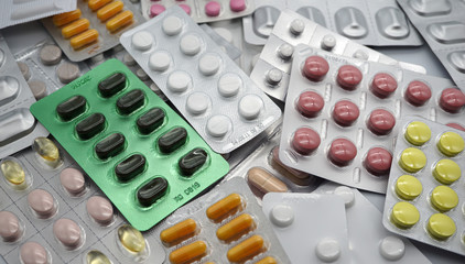 Different medicines: tablets, pills in blister pack, medications drugs, vitamins, macro, selective...