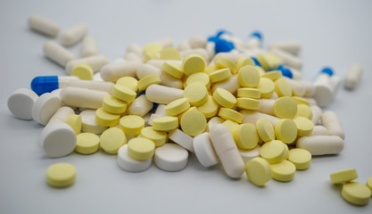 Fototapeta na wymiar Different medicines: tablets, medications drugs, vitamins, macro, selective focus. pink pills. yellow pills. white pills. 