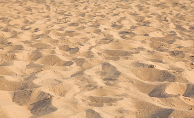 Closeup of sand pattern of a beach in the summer. Background.concept for summer season