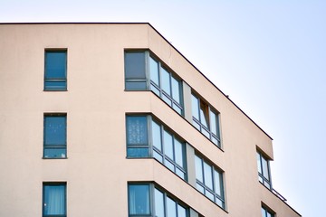 Modern apartment buildings on a sunny day with a blue sky. Facade of a modern apartment building