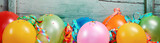 Festive banner with balloons and ribbons