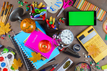 Back to school. Items for school classes in the composition on the table.