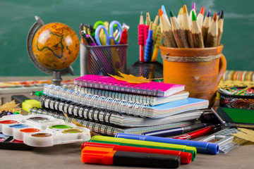 Back to school. Items for school classes in the composition on the table.