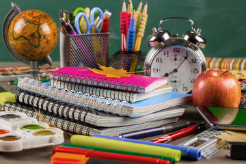 Back to school. Items for school classes in the composition on the table.