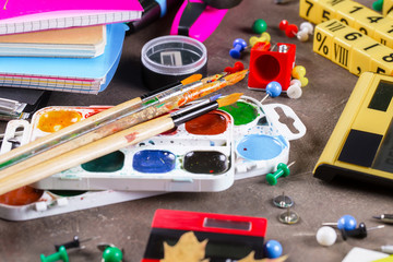 Back to school. Items for school classes in the composition on the table.