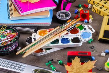 Back to school. Items for school activities rotate on the table.