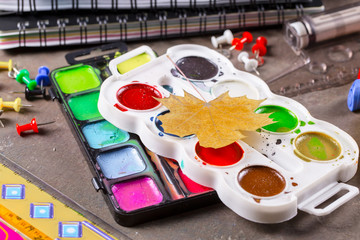 Back to school. Items for school activities rotate on the table.