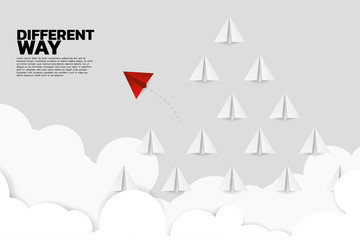 red origami paper airplane go different way from group of white. Business Concept of disruption and vision mission.