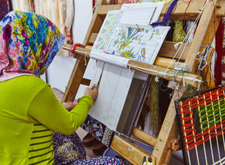 Persian carpet tailoring women in headcloth