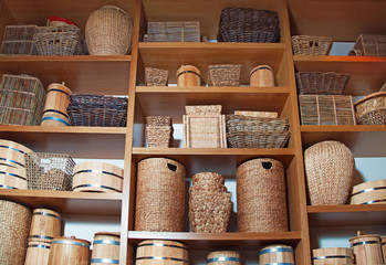 Room decoration in rustic style with many different baskets and barrels