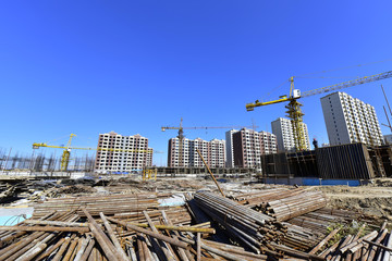 Fototapeta premium The crane is at work, at the construction site