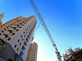 The crane is at work, at the construction site