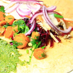 vegetable pancake vegan with sauce, carrot, onion,  parsley and cabbage