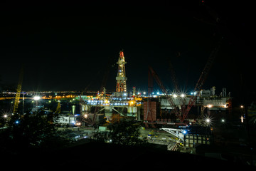 Fototapeta na wymiar Baku shipyard.Baku port.Night view.Oil platform under repair.District Bail