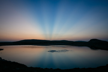 Mud volcanoes of Azerbaijan at sunset in the blue sky.Healing mud.