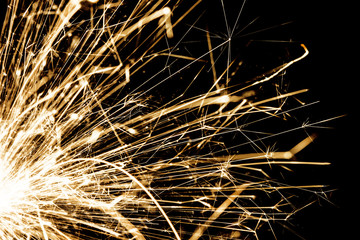 New years eve sparkler isolated on black. Shiny blow of firework sparks.