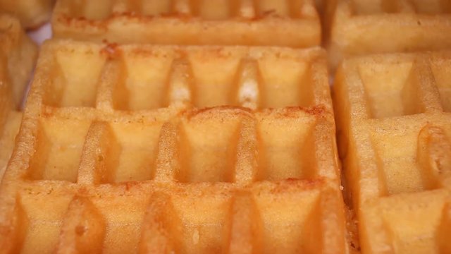Waffle waffles food closeup texture pattern. Seamless looping video footage