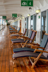 Deck chairs lined up on cruise ship