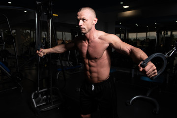 Muscular Man Exercising Chest