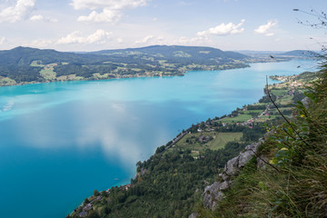 Attersee lake in Austria, with clouds reflecting in, as seen from above, on a clear, Summer day. European holiday destination near Salzburg.