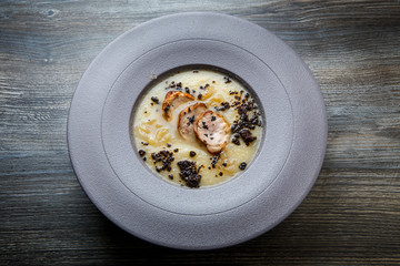 top view fresh onion cream soup decorated with homemade sausage
