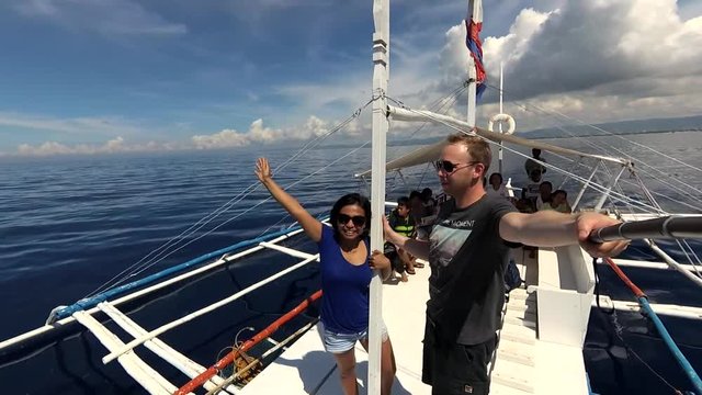 Cebu, Philippines - Couple taking a selfie on a Bangka Boat during an Island Hopping Tour in Mactan