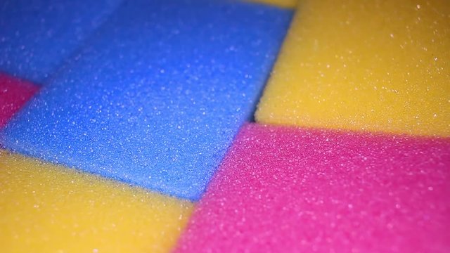 Kitchen cleaning sponge closeup texture pattern. Seamless looping video footage