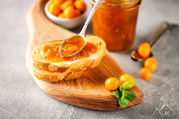 Jam in a jar and fresh fruits
