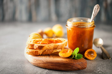 Jam in a jar and fresh fruits