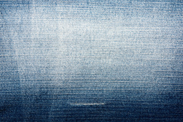 Shabby denim texture for background. Blue jeans 