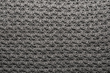 The texture of the knitted gray fabric for the background  