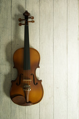 Fototapeta na wymiar Violin on wood background