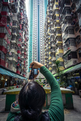 Person photographing buildings