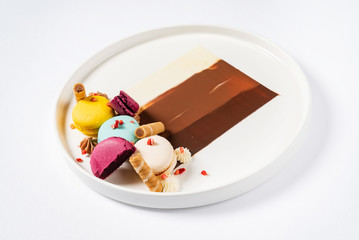 Sweet and colourful dessert with macaroons and chocolate