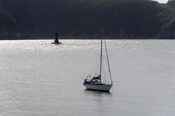 Sailboat moored in Cedeira coast (La Coruna, Spain).