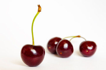 Ripe red sweet cherry, close-up on a white background, isolate