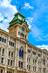 Fototapeta na wymiar Municipio clock tower building of Trieste in Piazza Unita Italia Italy vertical landmark background