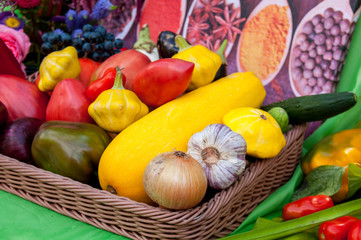 Autumn harvest: vegetables in a basket, zucchini, onion, eggplant, pepper, tomatoes