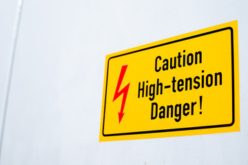 Danger High Voltage Sign for risk on yellow background.