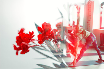 double exposure woman practising yoga and toned oleander flowering branch on white...