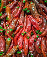 Pile of sweet red peppers of a new sort on Mediterranean market