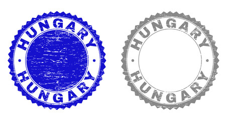Grunge HUNGARY stamp seals isolated on a white background. Rosette seals with grunge texture in blue and grey colors. Vector rubber stamp imitation of HUNGARY title inside round rosette.
