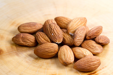 Almond on wood background