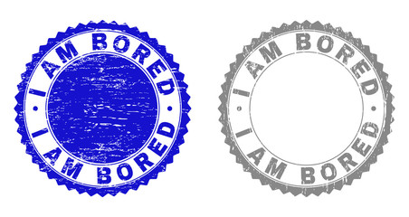 Grunge I AM BORED stamp seals isolated on a white background. Rosette seals with grunge texture in blue and gray colors. Vector rubber stamp imitation of I AM BORED caption inside round rosette.