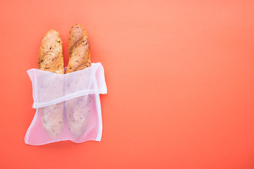 Zero waste house shopping kitchen products. The main modern concept is no plastic. On a pastel colored background bread, baguettes. Eco bag package. Copy space,