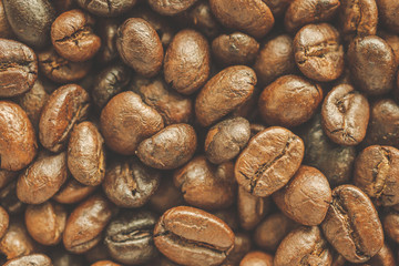 Roasted coffee beans closeup texture background