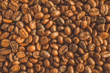 Roasted coffee beans closeup texture background