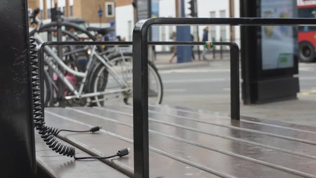 An outdoor charging station with unplugged chargers.